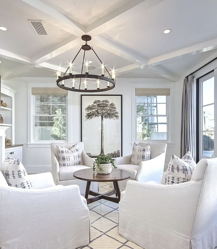 living room with white armchairs