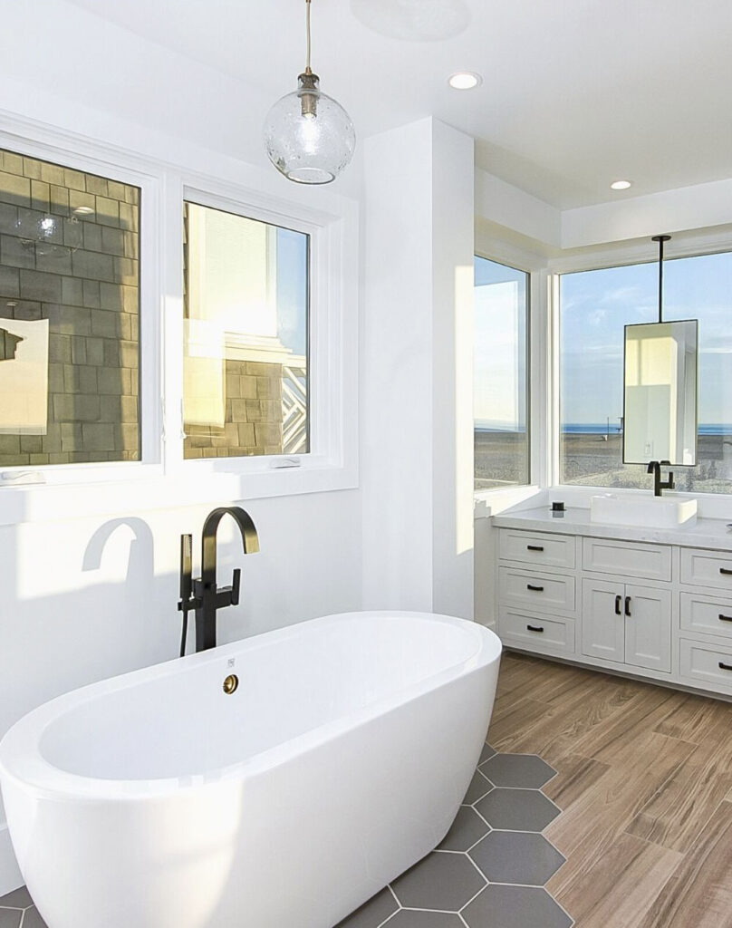 bathroom with tub and view