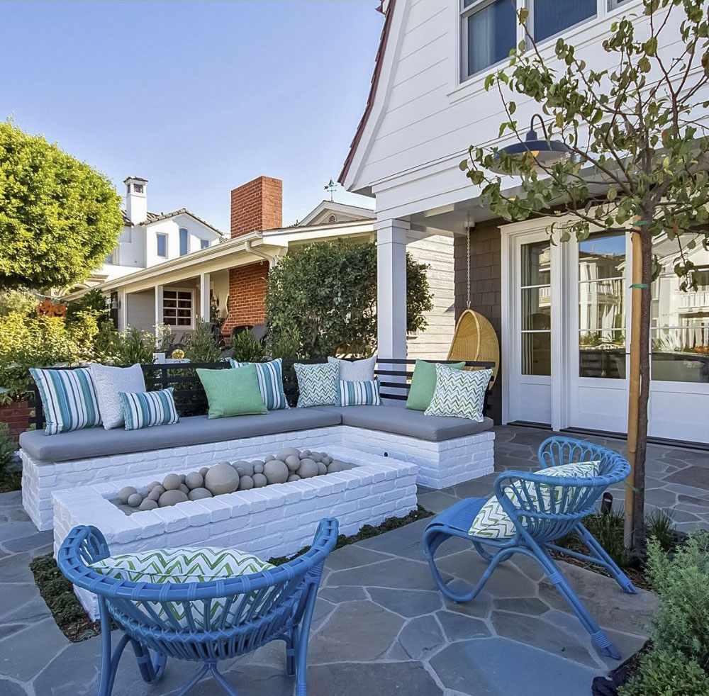 front yard patio with fire pit and blue garden furniture