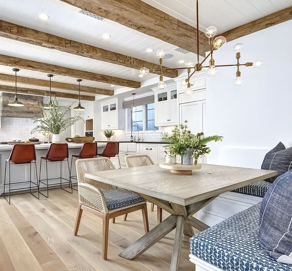 breakfast area and kitchen with ceiling beams